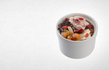 herb soup or chinese herb soup on a background.