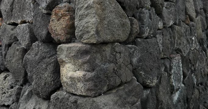 Ancient Hawaiian temple volcanic rock wall Hawaii. Most active volcano in the USA. Big Island tourism destination for science, exploration and tourist education.