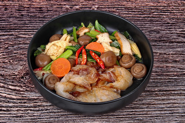 Fried big noodle topped mixed vegetables for organic food.