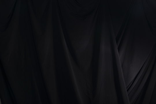 Black Curtain drape wave with studio lighting