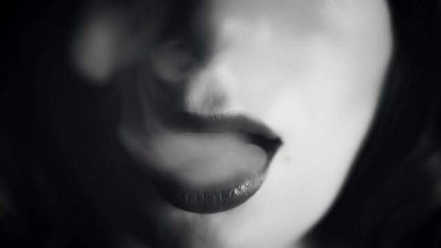 4k Close-up of Woman Mouth with Smoke, black and white
