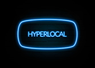 Hyperlocal  - colorful Neon Sign on brickwall