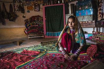 Young woman from Meghwal tribe showing handicraft