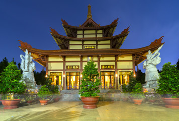 Ho Chi Minh City, Vietnam - September 5th, 2017: Architecture temple at night when lights flickered as glorified spiritual beauty. A peacefull place to calm mind and soul in Ho Chi Minh city, Vietnam