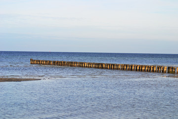 Fototapeta na wymiar Shot of wooden groins on the island Poel, Baltic Sea, Germany