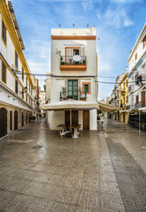 Typical street in old town of Ibiza, Balearic Islands, Spain. Morning light