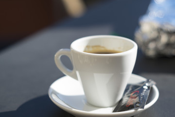 Espresso coffee served on a white cup