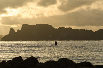 Fototapeta premium Fisherman fishing in the sea at Krabi, Thailand