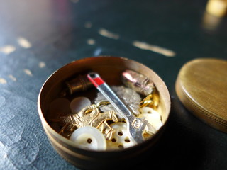 small golden button tin with lid