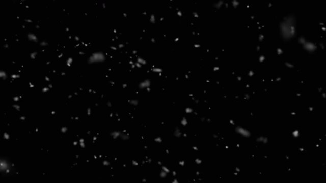 Snow. Winter snowfall. Falling realistic snowflakes on a black background. Loop animation.