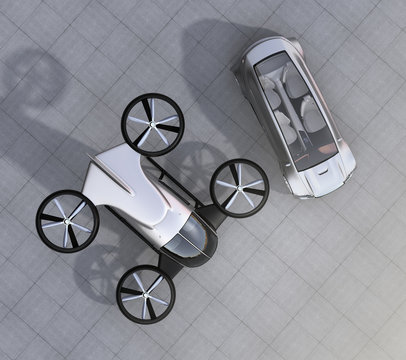 Top view of self-driving car and passenger drone parking on the ground. 3D rendering image