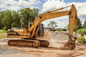excavator on the workplace construction road at countryside
