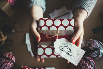 Woman Holding a Christmas Present