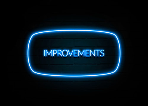 Improvements  - colorful Neon Sign on brickwall