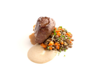 Fillet mignon with lentil and sauce isolate