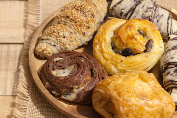 a variety of bakery on wooden plate