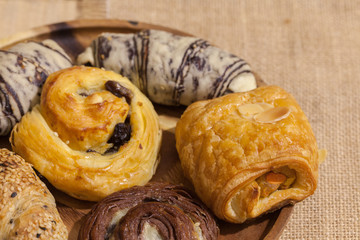 a variety of bakery on wooden plate