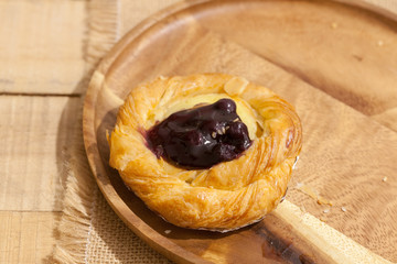 a variety of bakery on wooden plate