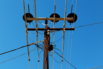 power line with electrical pole in the clear sky