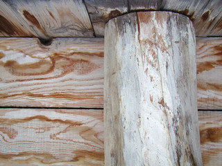 Old wooden wall with log closeup