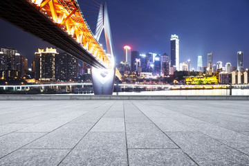 Fototapeta premium empty marble floor with modern bridge and modern city