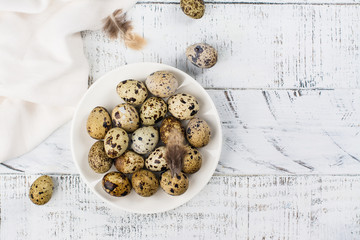 Quail eggs on white plate. Rustic style