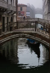 Papier Peint photo Pont des Soupirs Venice, Italy, Gondola below a bridge on the canals of the city