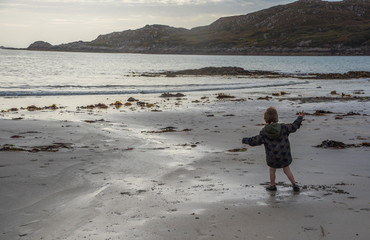 Child Playing on the Beach