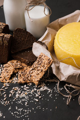 Rustic local dairy. Milk and cheese. Quality sort bread with bottles, free space. Upmarket produces concept