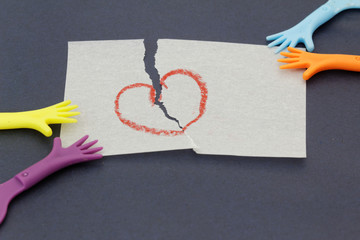 Replica of hand pulling paper with love symbol. Concept of divorce,child custody,matrinomial.