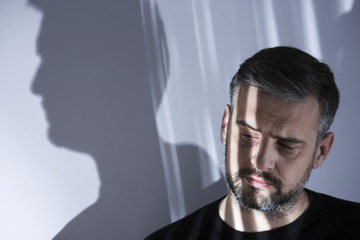 Unhappy man isolated from society