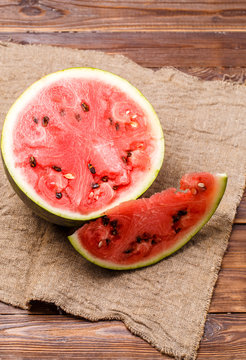Photo of cut watermelon on cloth