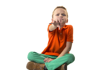 funny boy on a white background wants something to take his hand and gets angry