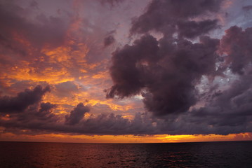 jamaican sunset, dark & cloudy - 177373575