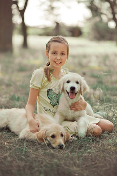 Retriever pup Lovely scene cute young teen girl enjoying posing summer time vacation with best friend dog ivory white labrador puppy.Happy airily careless childhood life world of dreams with puppies