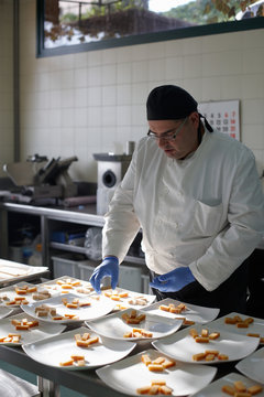 Chef preparing spanish christmas dessert for a feast