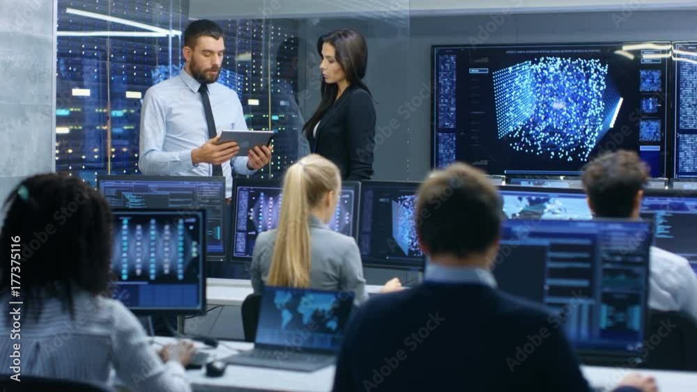Poster Head of the Department and Project Manager Discuss Work Process Using Data on Tablet Computer. Multi-Ethnic Team Builds Neural Network with Integrated Machine Learning.