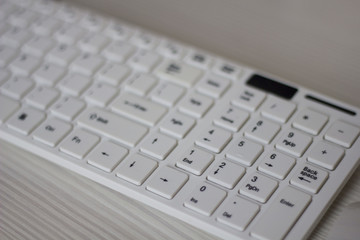 white computer keyboard on white table