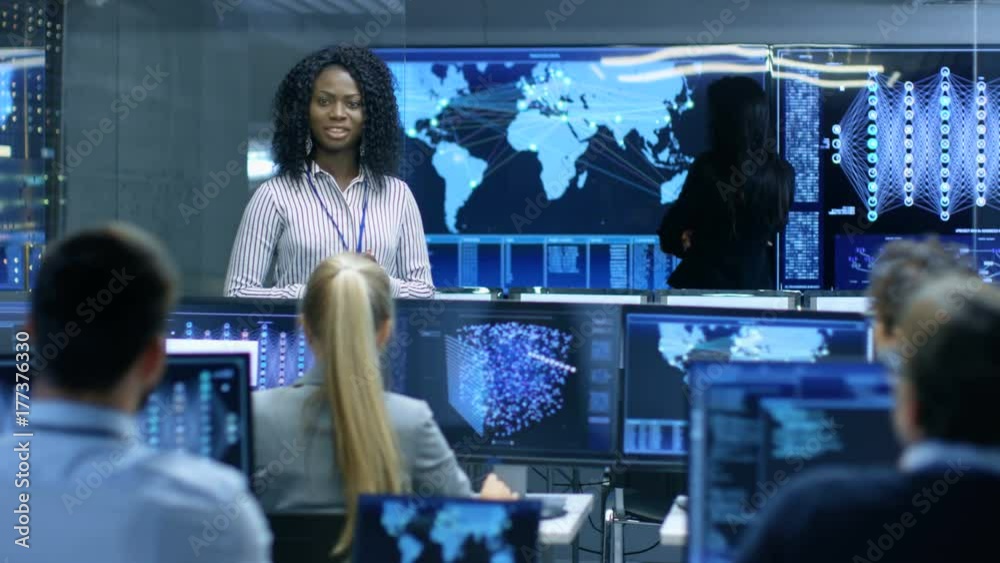 Poster Chief Project Engineer Holds Briefing for a Team of Scientists that are Building Machine Learning System. Displays Show Working Model of Neural Network. 