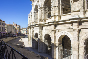Naklejka premium The Arles Amphitheatre (Arenes d'Arles in French), a two-tiered Roman amphitheatre in the southern France town of Arles. A World Heritage Site since 1981