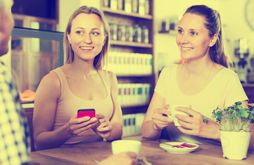 happy people spending time in cafe