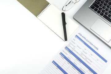 Job application form for business concept with glasses, pen, note and laptop isolated on white background