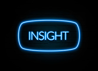 Insight  - colorful Neon Sign on brickwall