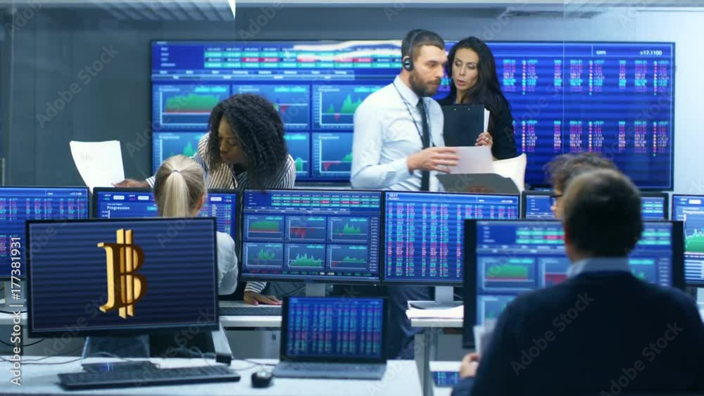 Poster multi-ethnic team of traders is busy working with cryptocurrency at the stock exchange office. deale