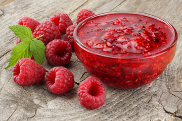 healthy food. raspberry with raspberry jam on old wooden background