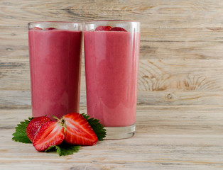 Strawberry cocktail. Fresh drinks, Smoothies. Detox drinks beautiful red strawberry on a wooden background.