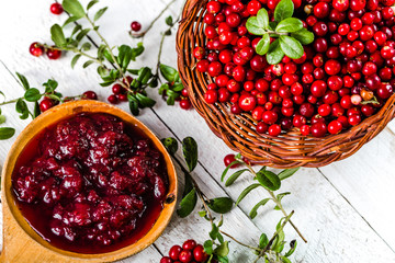 Berry jam in a bowl on wooden table, natural organic food - homemade preserve for winter