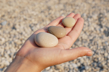 Hand holding stones