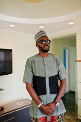 Rich african man at his appartment. Portrait of successful black man indoor.