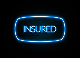 Insured  - colorful Neon Sign on brickwall